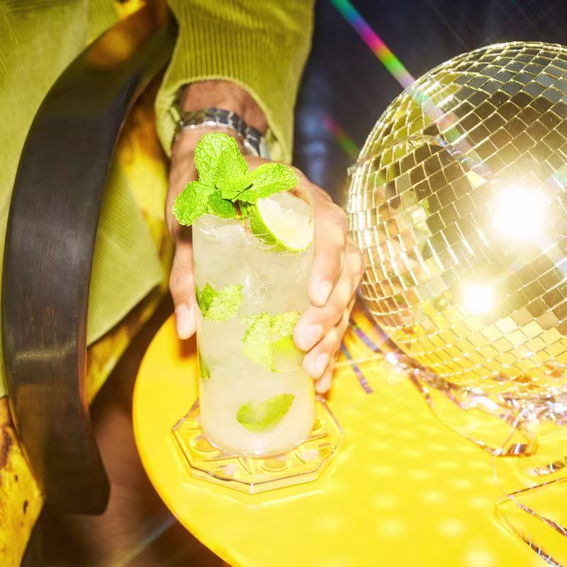 Tequila-based mojito cocktail on a table.