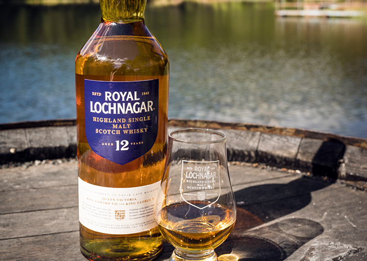 Royal Lochnagar 12 bottle with glass over barrel