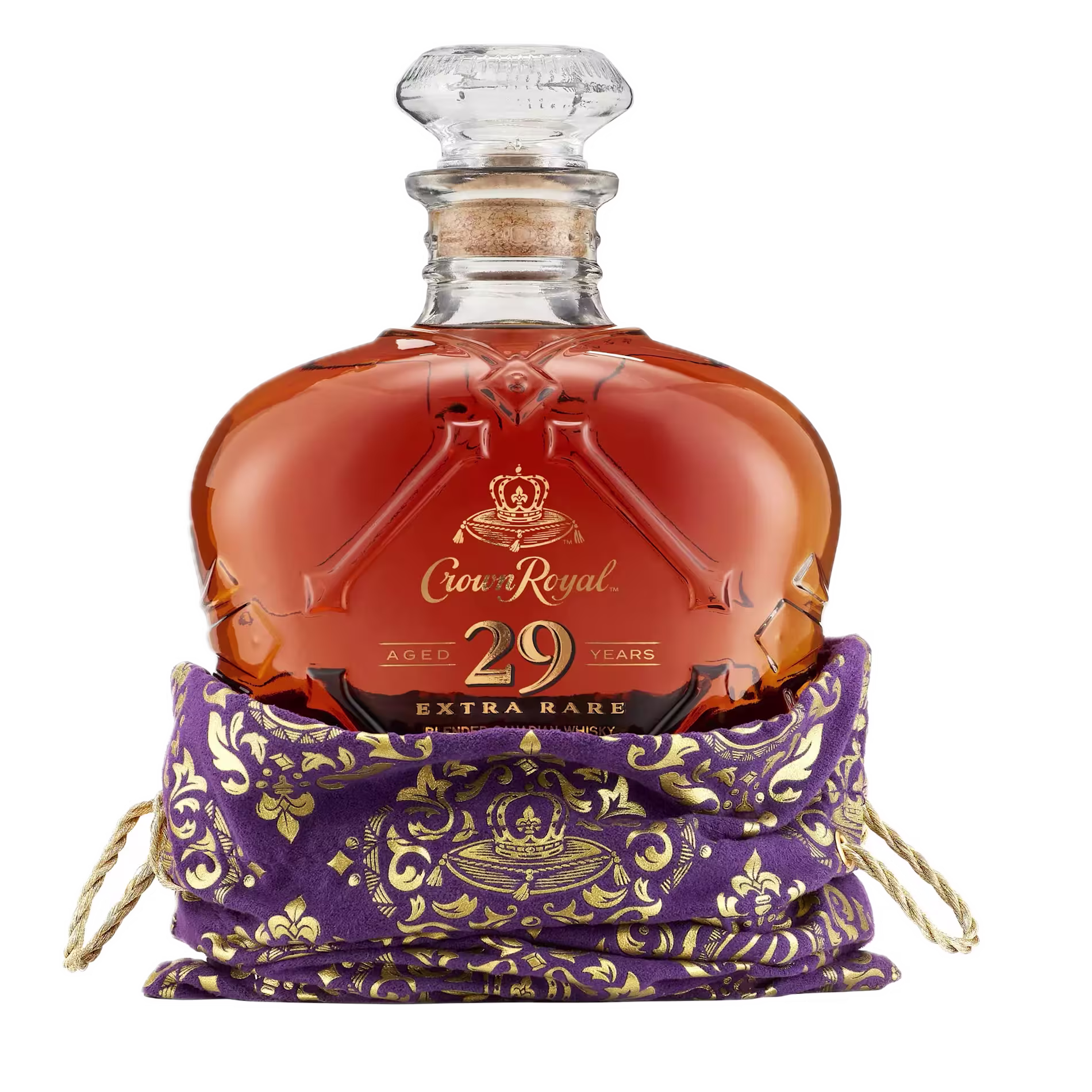 A bottle of Crown Royal 29 Year Old Extra Rare whisky in a decorative purple and gold pouch.