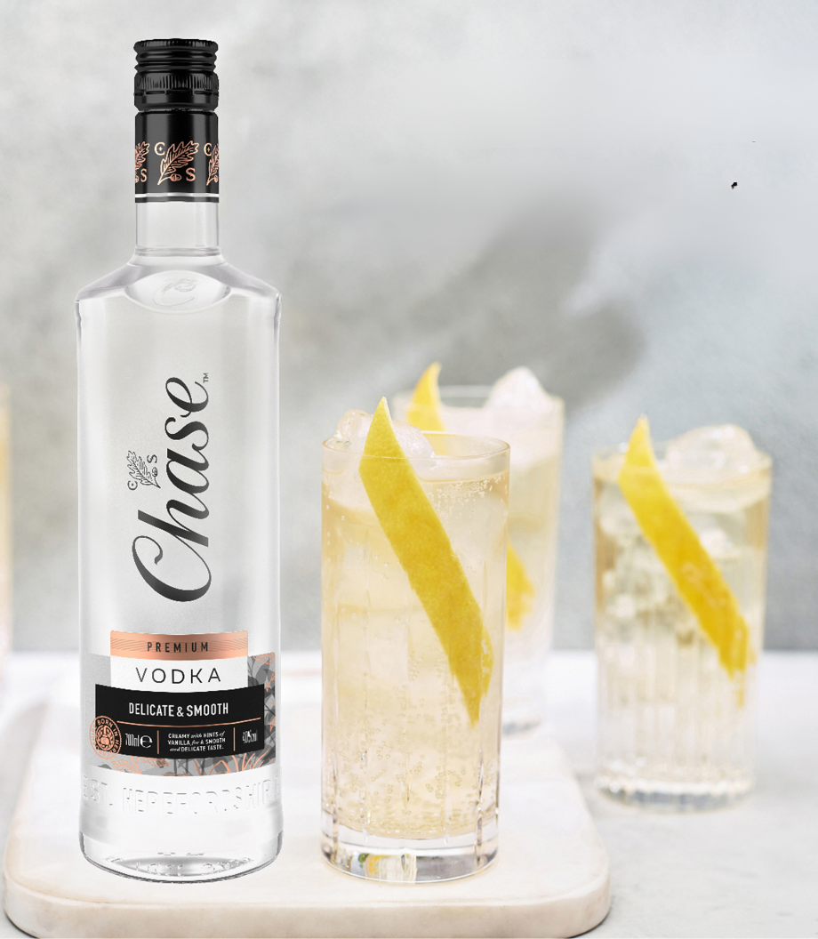 Chase Premium Vodka next to 3 cocktails