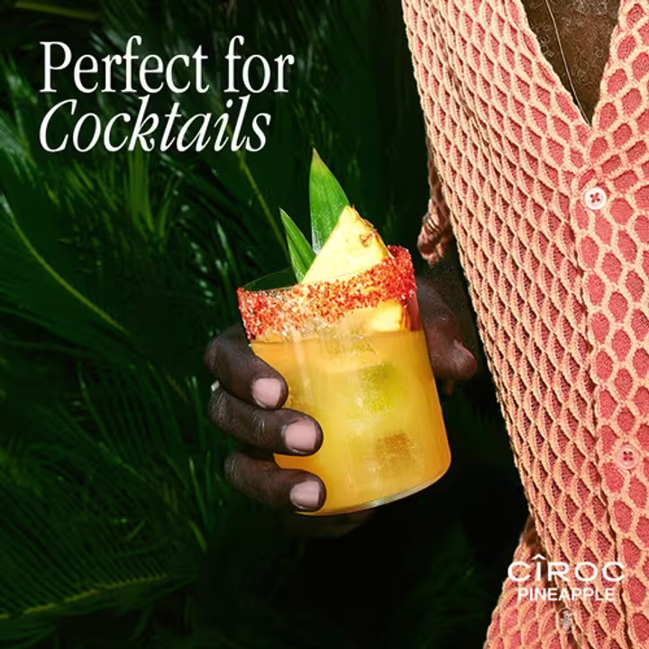 CÎROC Pineapple cocktail in persons hand