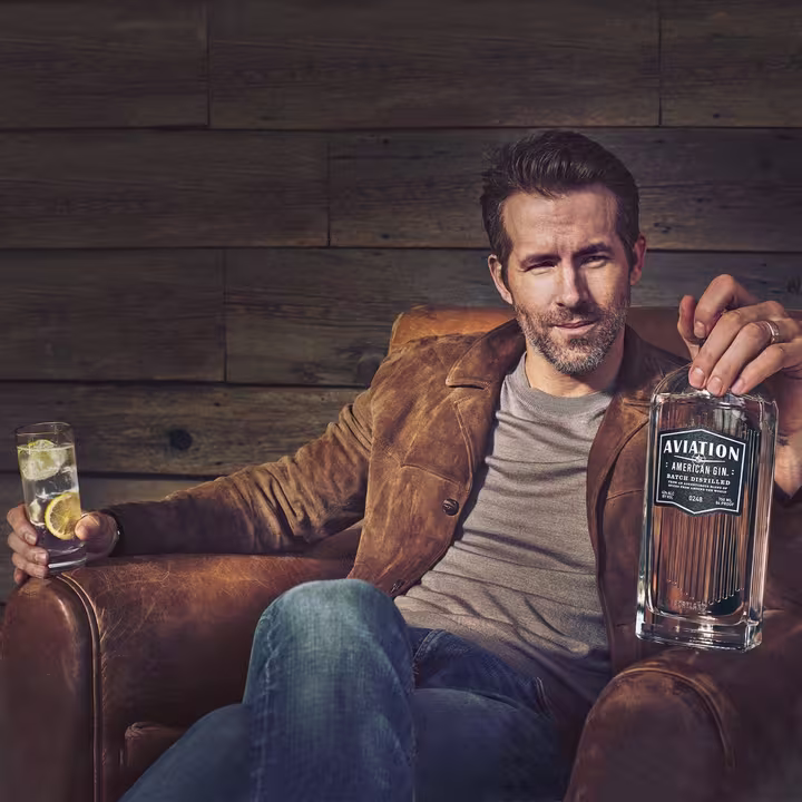 Ryan Reynold sitting on a couch