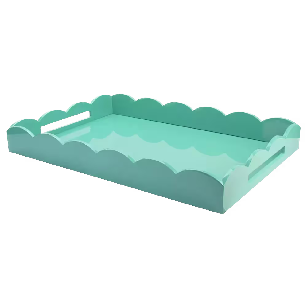 Rectangular turquoise tray with scalloped edges and cutout handles on each side, shown against a black background.