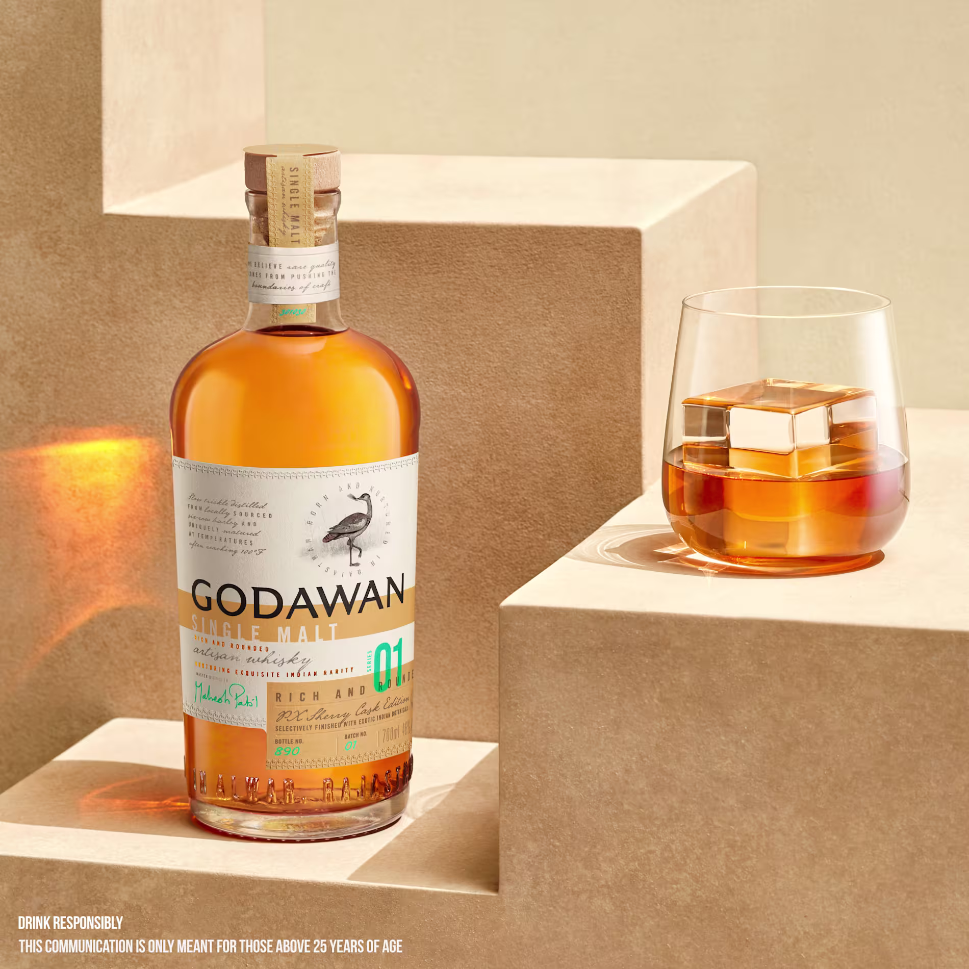 Two Godawan whisky bottles on stairs