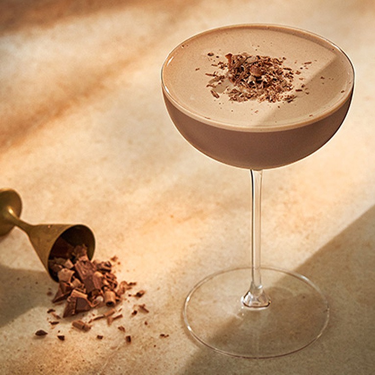 Chocolate cocktail with cocoa powder on the top.