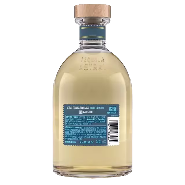 A clear glass bottle of Astral Tequila Reposado with a wooden cap, showing product and barcode labels on the back.