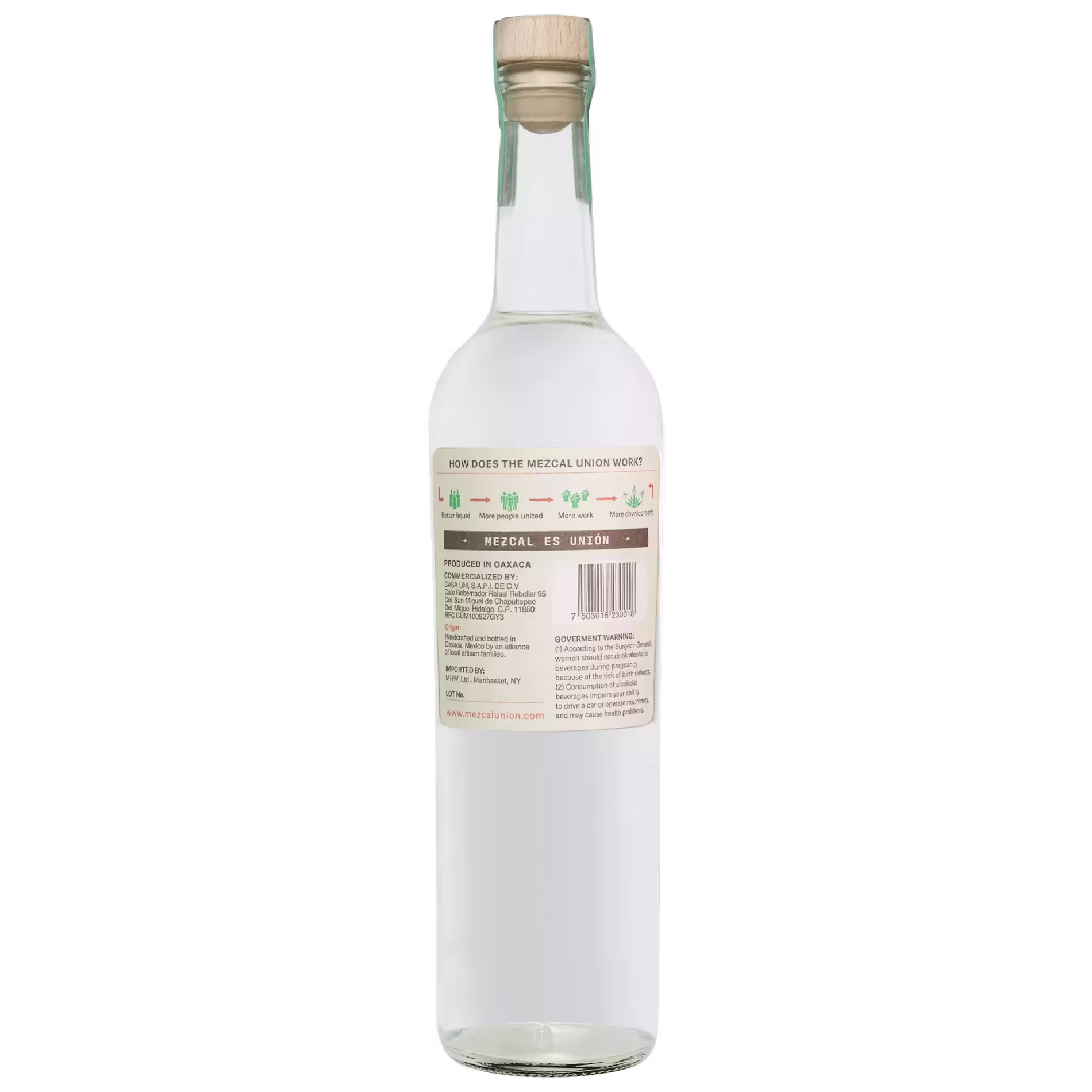A clear glass bottle with a wooden cap, showing a label with text and graphics about mezcal production on the back.