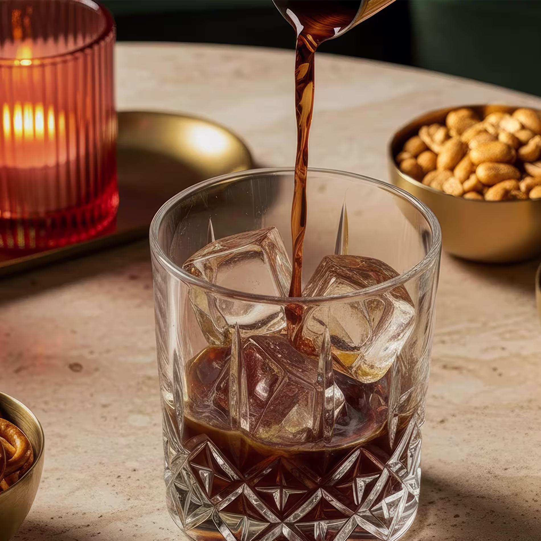 Vodka and coffee liqueur are poured into the rocks glass