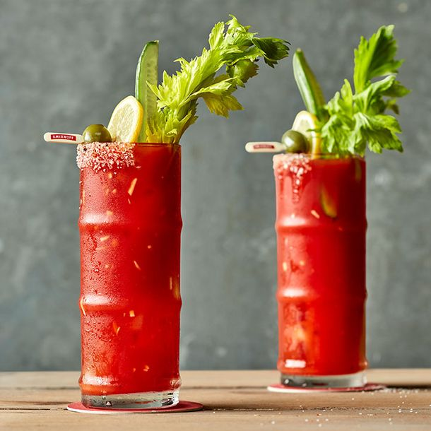 Two Bloody Mary’s made with Smirnoff No. 21 Vodka and topped with olive, lemon, cucumber, and lettuce garnish