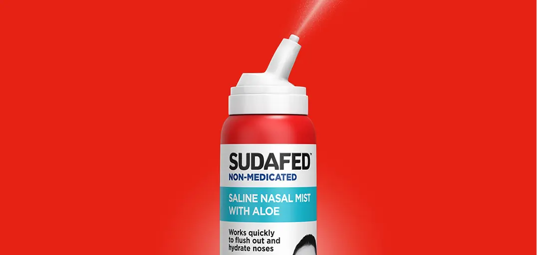 SUDAFED® Non-Medicated Saline Nasal Mist with Aloe bottle on a red background