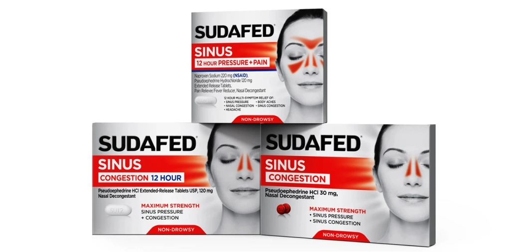 Three Sudafed Products Piled Up, two on the bottom and one on top. All facing forward.