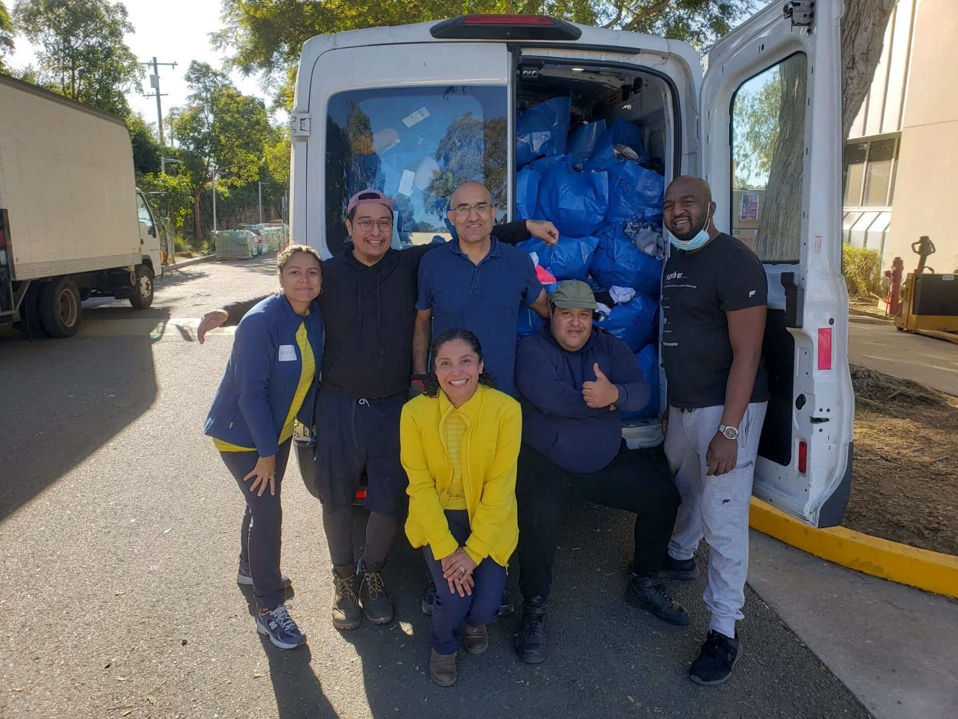 The IKEA team behind a van.
