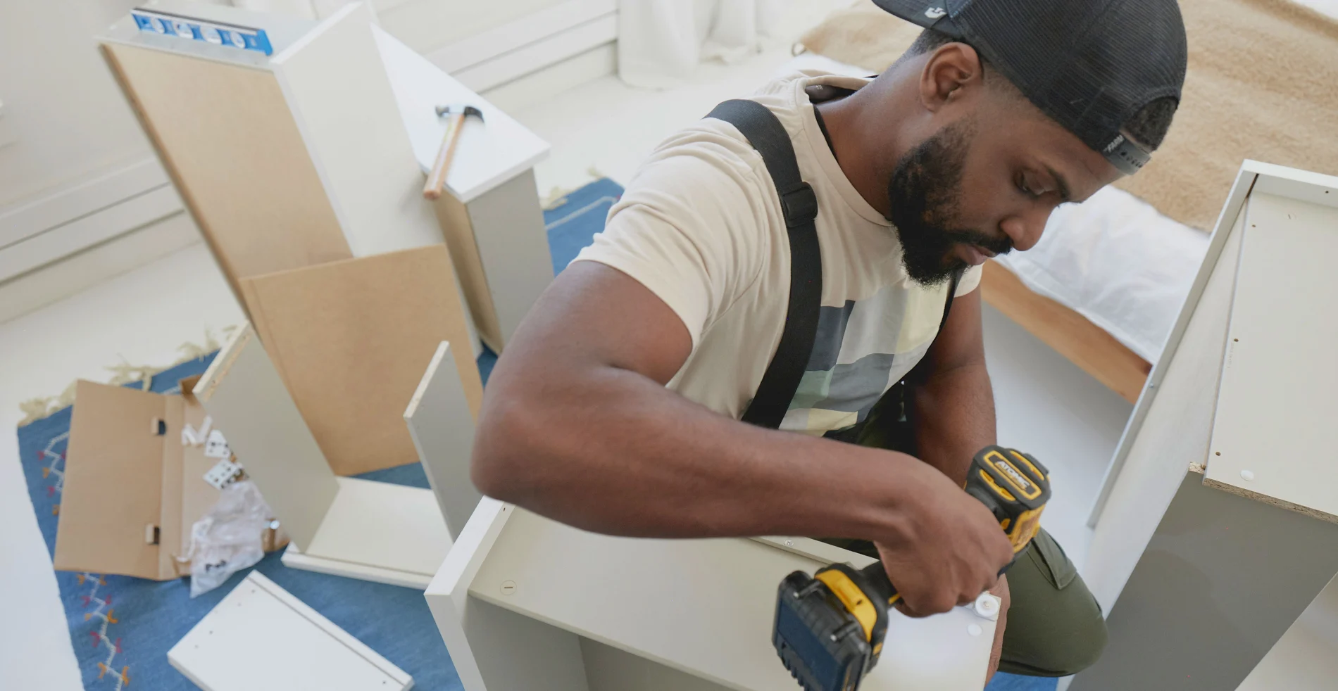 Image of a Tasker assembling furniture