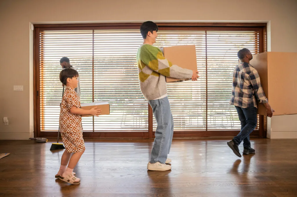 A picture of a family moving boxes