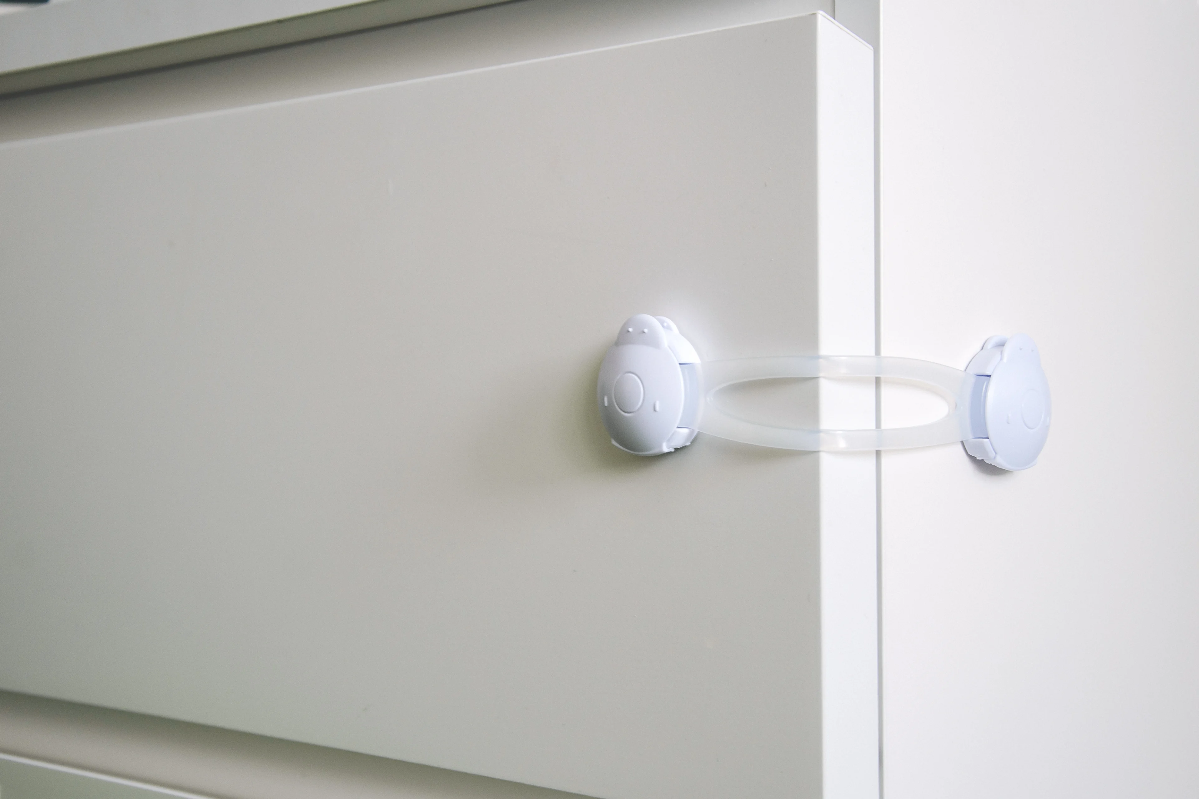 a picture of a drawer secured with a child-proof locking device