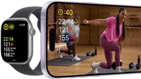 Apple Watch next to iPhone with Apple Fitness+ class on screen