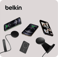 Three smartphones with a variety of Belkin wireless chargers.