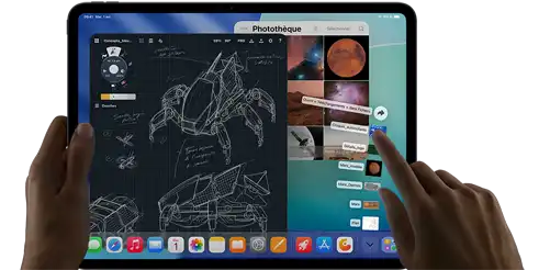 iPad Pro, noir infini, main gauche tenant l’appareil, main droite pointant du doigt pour manipuler de multiples fenêtres d’apps, app de dessin avec des croquis d’engins mécaniques, photothèque avec des images de planètes et de l’espace, dossier Téléchargements avec fichiers déployés