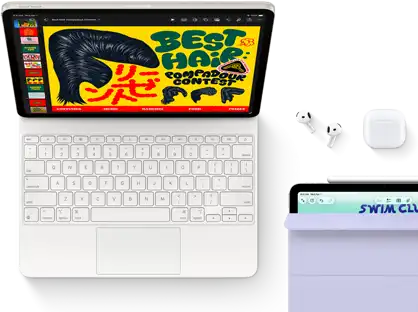 iPad Air, Starlight colour, colourful graphics on screen, attached to Magic Keyboard, AirPods Pro and Apple Pencil Pro accessories