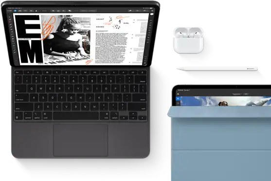 iPad Pro attached to Magic Keyboard, front exterior, space black colour, rounded corners, black display bezel, open, display showing article editing app with text and photograph of a woman playing music, Airpods 4 in open case, blue Smart Folio cover on iPad Pro with Apple Pencil Pro resting atop device, cover slightly open revealing display