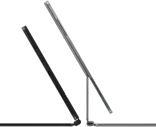 2 iPad Pro devices attached to Magic Keyboard, side exterior, thin profile, space black colour with speakers and USB-C port, tilted half open, silver colour, open, tilted back showing the keyboard’s floating cantilever design, speakers and microphone