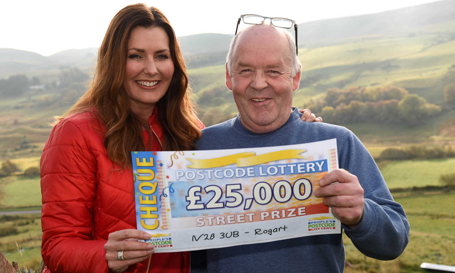 Saturday's Street Prize winner, Michael MacPherson in Rogart, alongside Judie McCourt and his £25,000 cheque