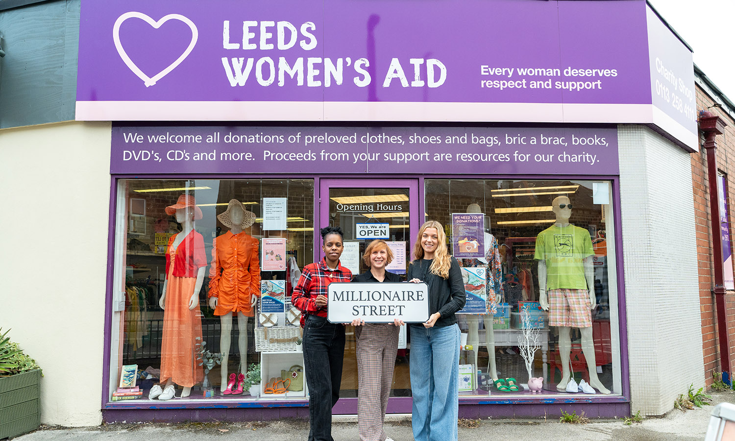 Samantha Lightfoot (centre) of Leeds Women's Aid outside their charity shop with Shop Supervisor Yolanda Nyamunda (left) and Marketing and Communications Manager Hannah Whyte (right)