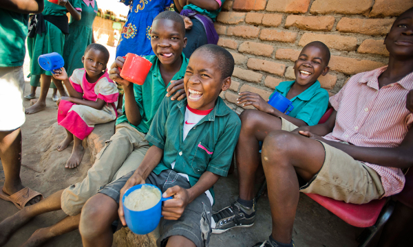 Mary's Meals. A group of laughing children.