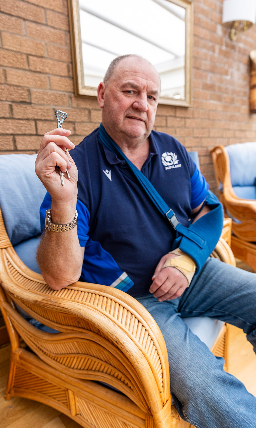 KEEPSAKE: Tommy with a copy of the plate inserted during his op