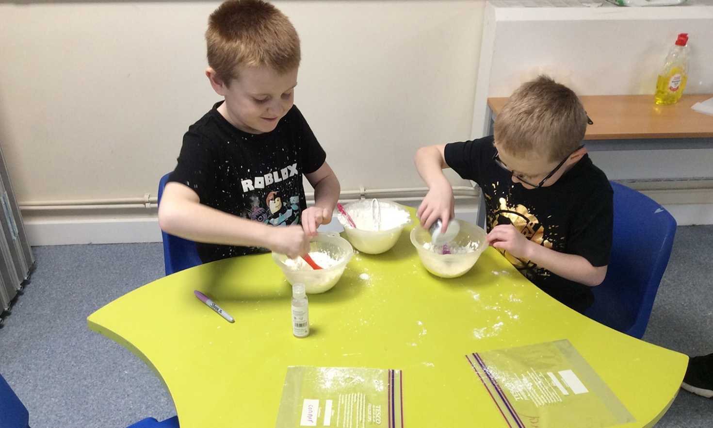 Children playing in the art and craft room at the Daisy Chain care centre