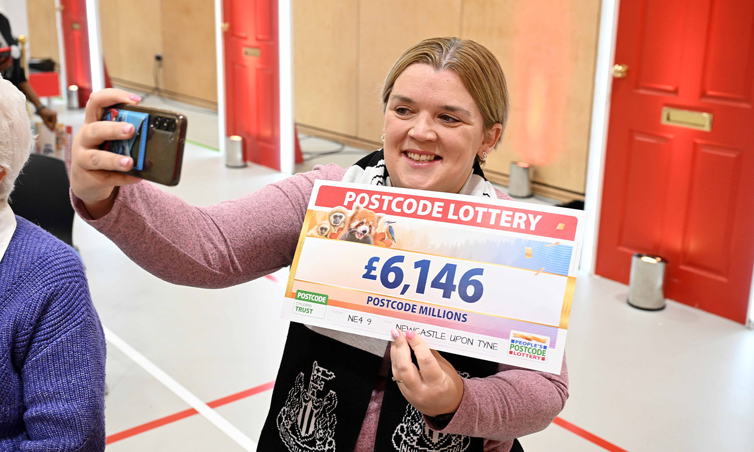 SELFIE CHEQUE: Zoe Dodds poses with cheeses at her windfall