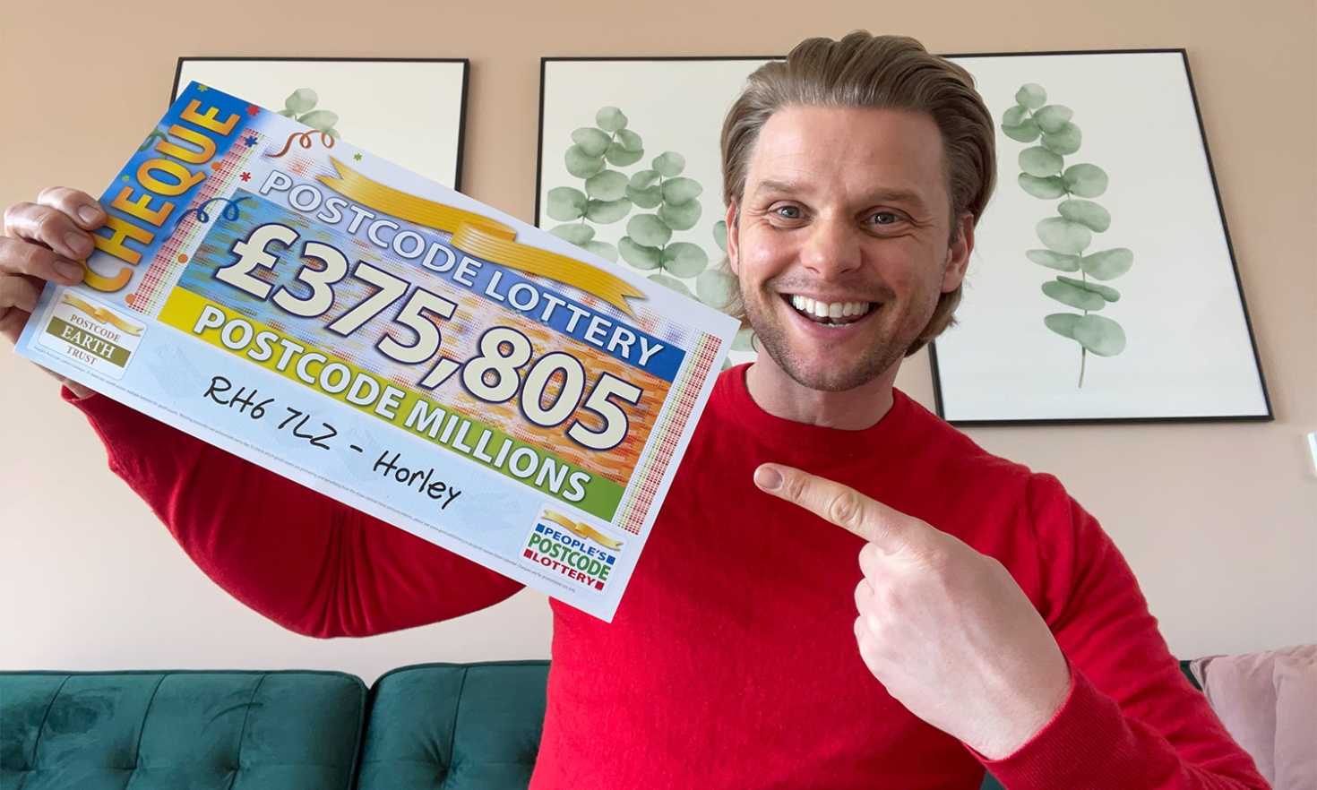 Jeff holds up one of our big winner cheques from today's Postcode Millions