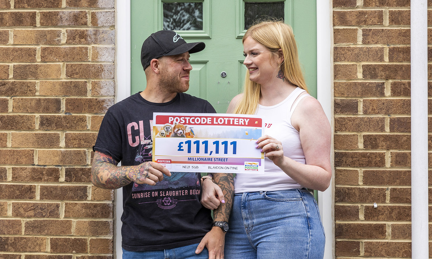 HOUSE ABOUT THAT! Christina and hubby Matthew outside winning address