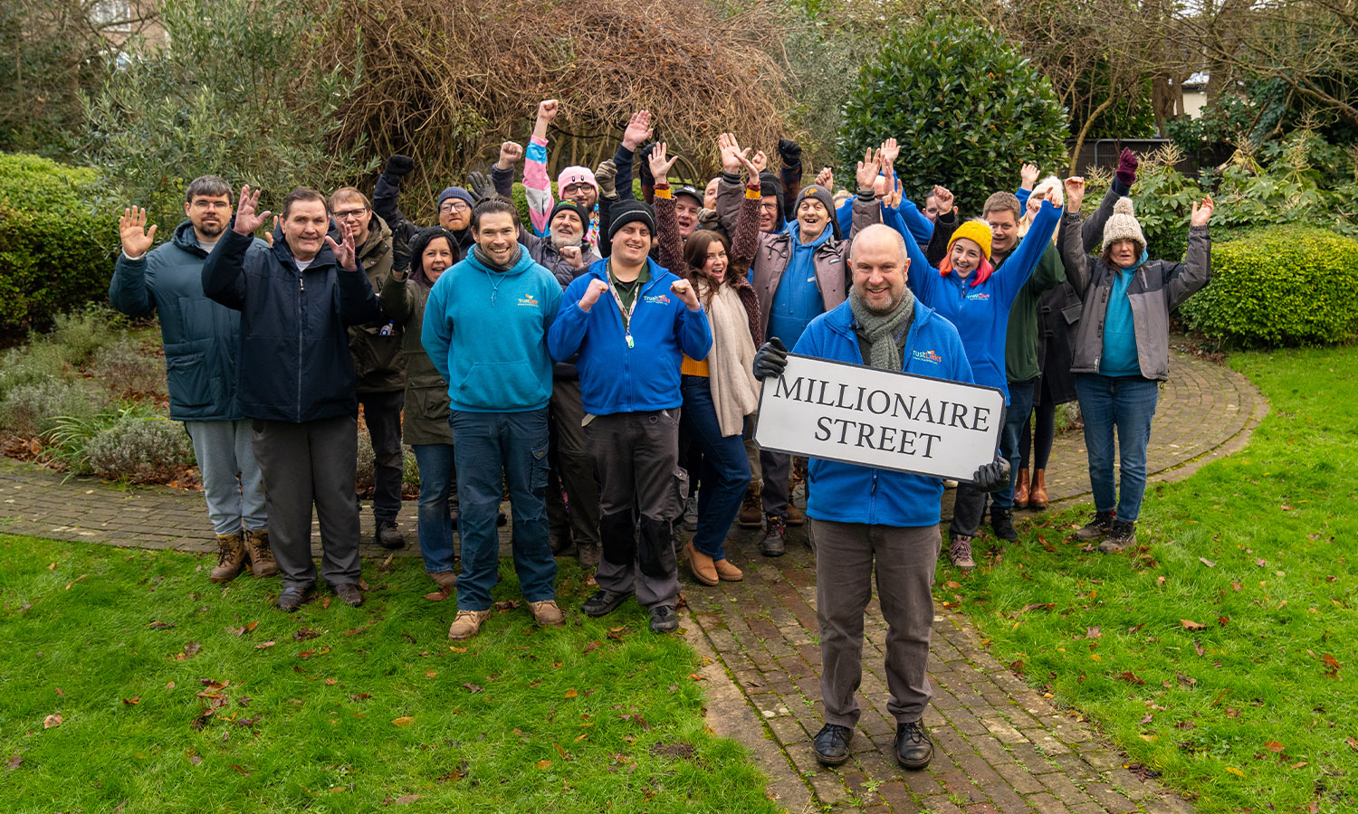 TRANSFORMING LIVES: Trust Links CEO Matt King celebrates with volunteers and members