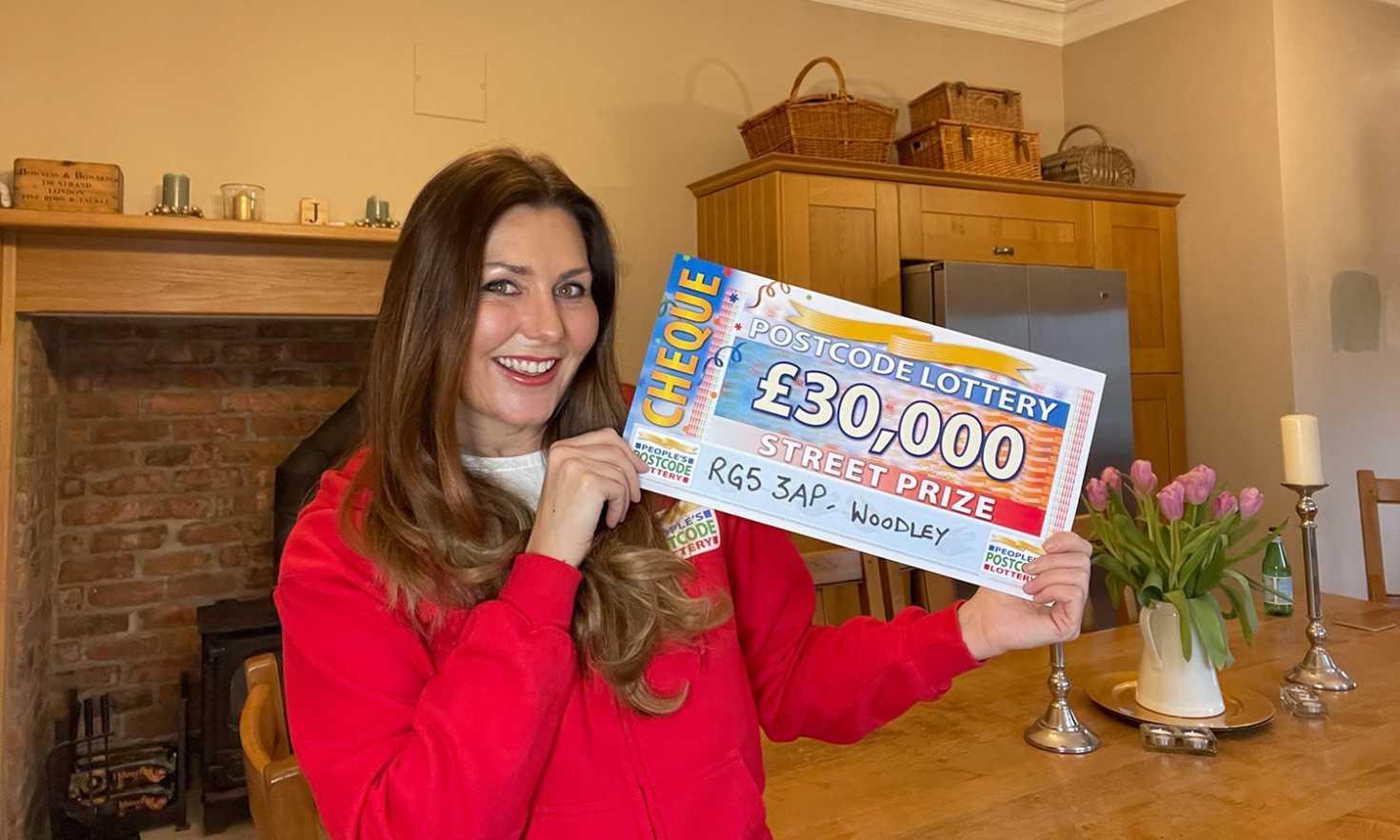 Judie has a super £30,000 cheque for each of our three winners in today's Street Prize