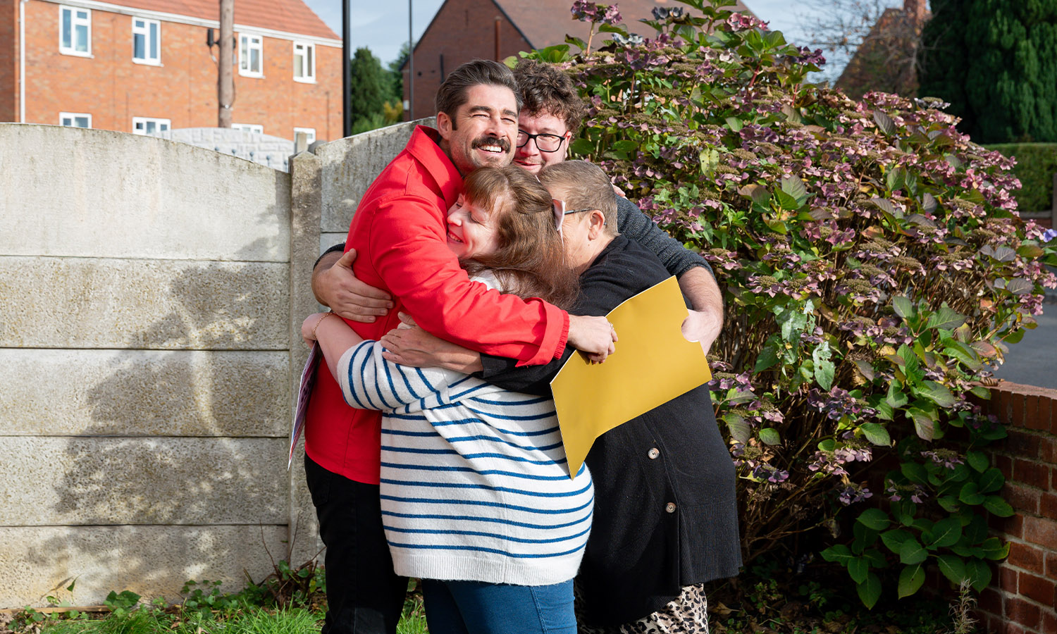 LOVELY CUDDLY: Lindsey and family hug Matt