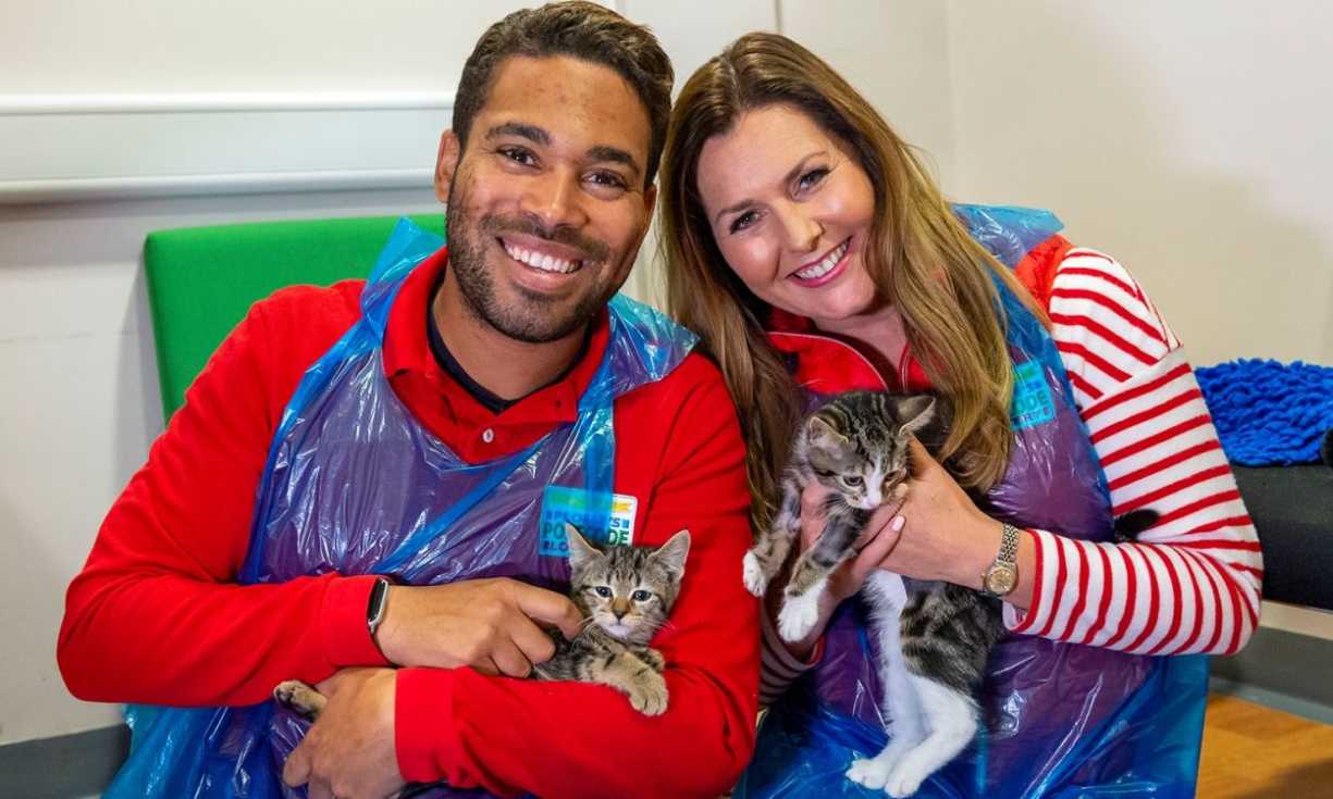 Danyl Johnson and Judie McCourt cuddling kittens at the Cats Protection's Warrington Adoption Centre