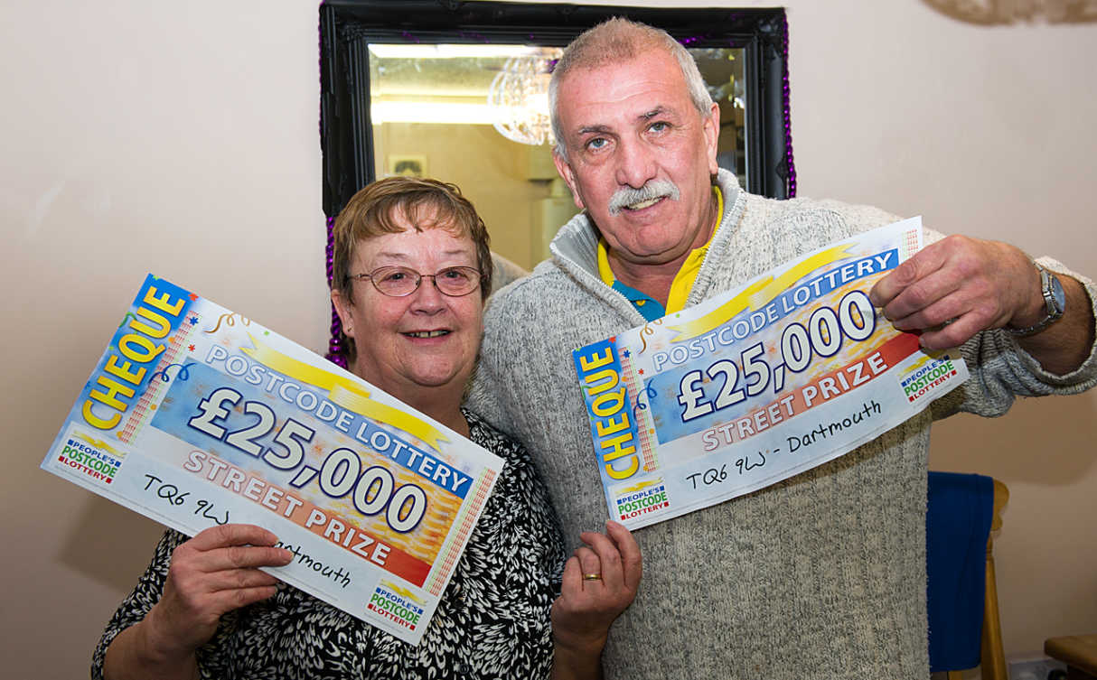 Rita and Michael from Dartmouth with their whopping £25,000 cheques