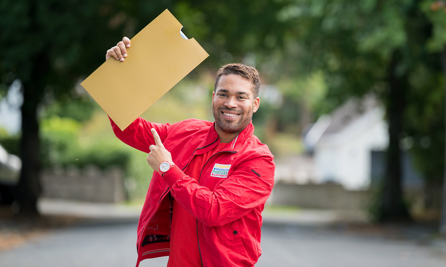 Presenter Danyl Johnson poses with our signature golden envelope