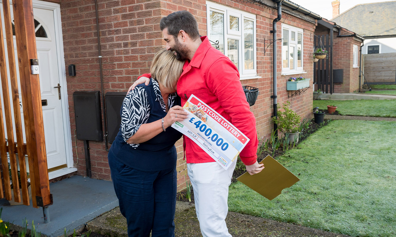 OVERWHELMING: Mandy sobs in the arms of Lottery's Matt Johnson