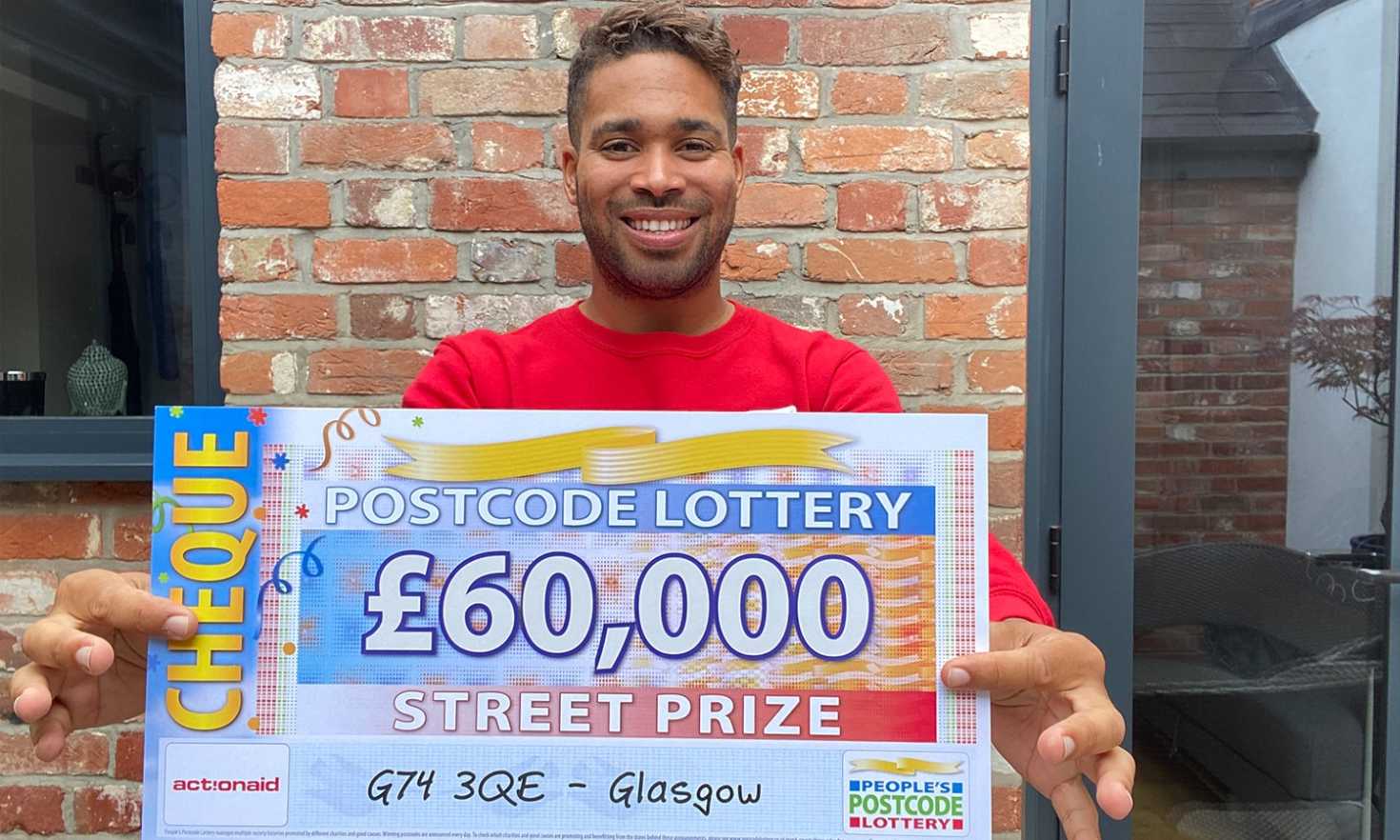 Danyl with a whopping £60,000 Street Prize for one of our five winners in Glasgow who plays with two tickets