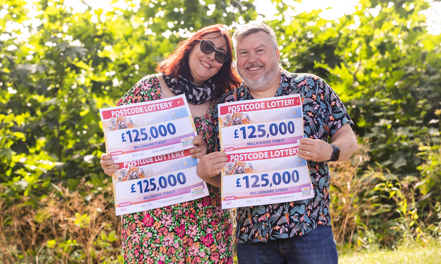 LIFE-CHANGING: £500,000 winner Mark and wife Billie pose with his winning cheques