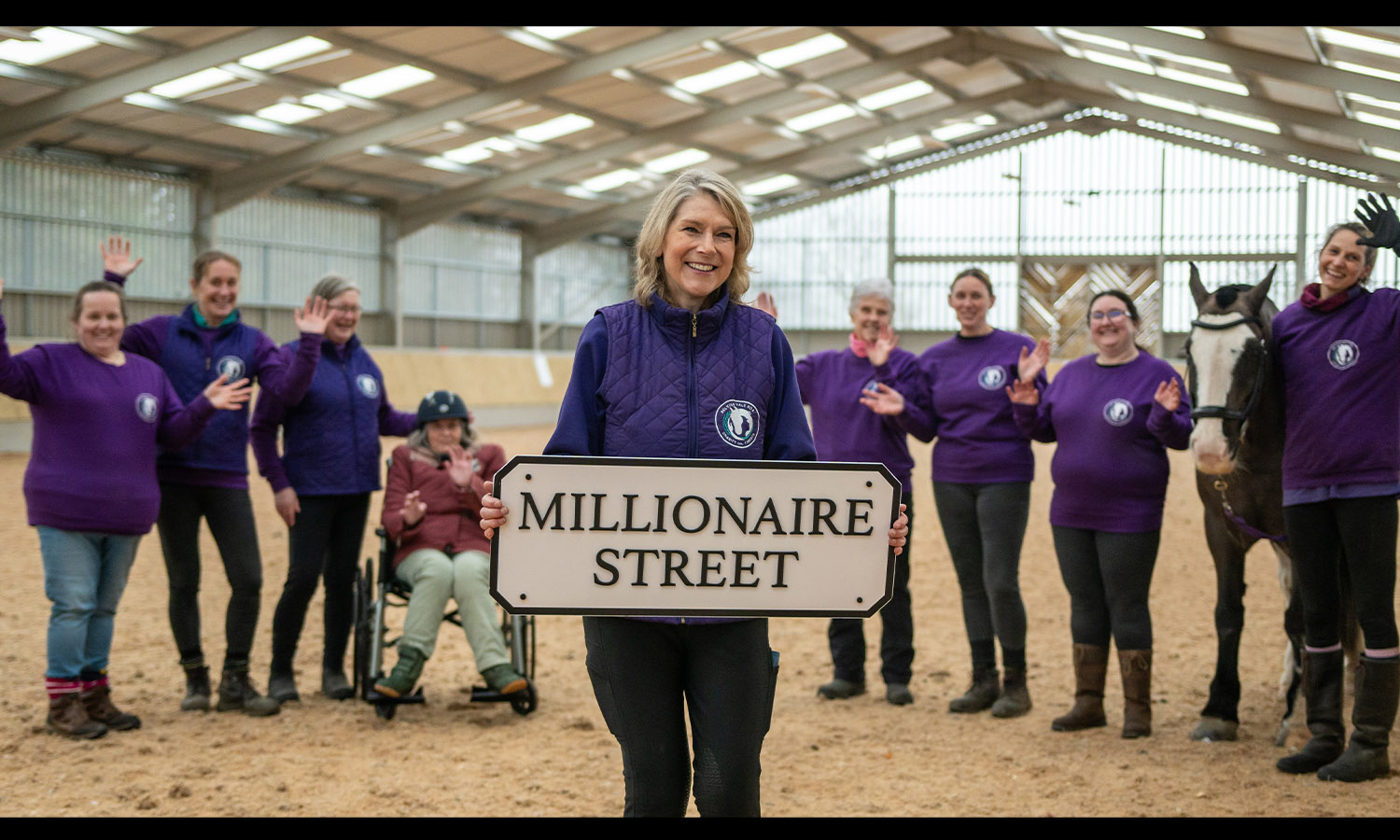 FOALS GOLD: Belvoir RDA's Lesley Davies, staff, volunteers and a wheelchair user