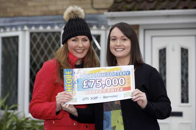 Sarah Walker, who plays with three tickets, celebrates her £75,000 win