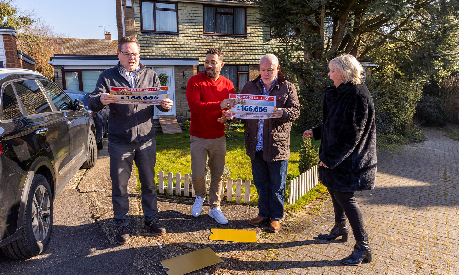 HIT FOR SIX: Bob, David and wife Nicola with lottery ambassador Danyl Johnson