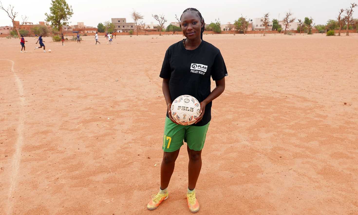 Bernadette coaches an all-female football team in Mali