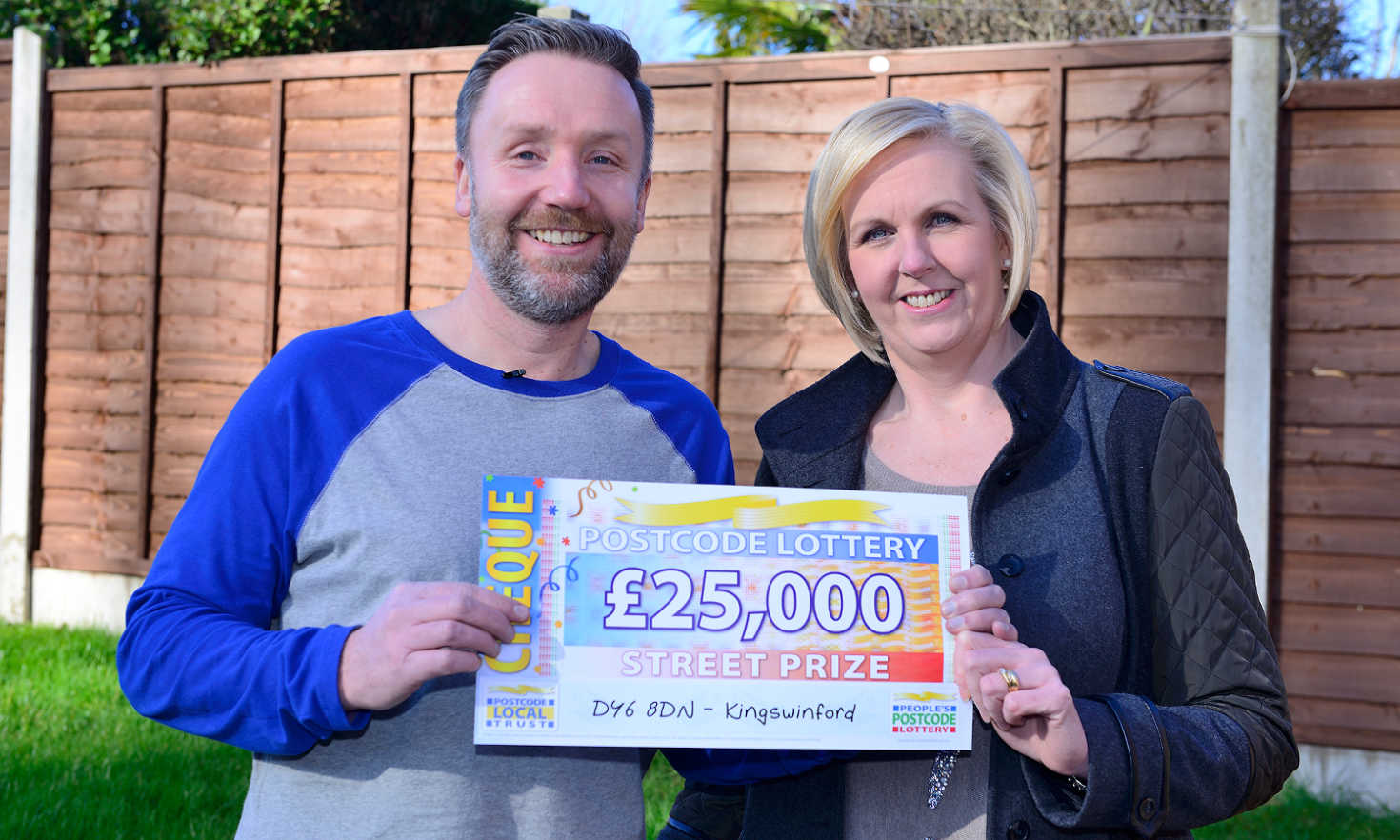 Judie presenting Andrew and Jo with a whopping £25,000 Street Prize cheque