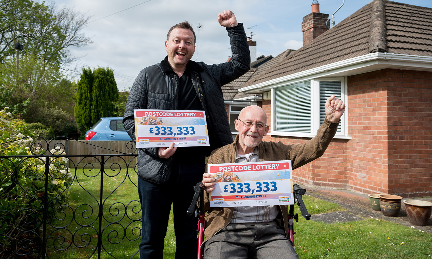 Neighbours Roly and Geoff are all smiles with their cheques