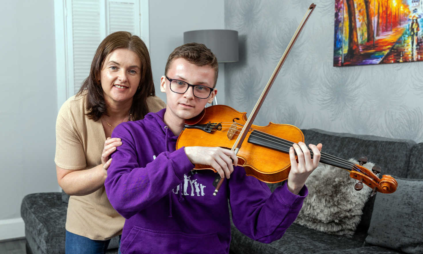 Aiden with his mum Julie, who couldn't be more proud of her son after he was awarded a music scholarship