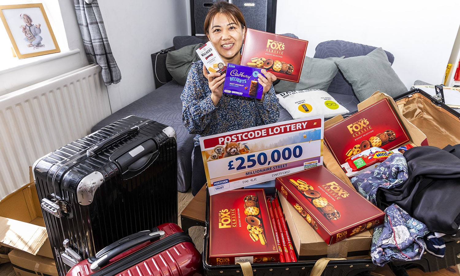 TAKES THE BISCUIT: Yu packs up treats for family in China